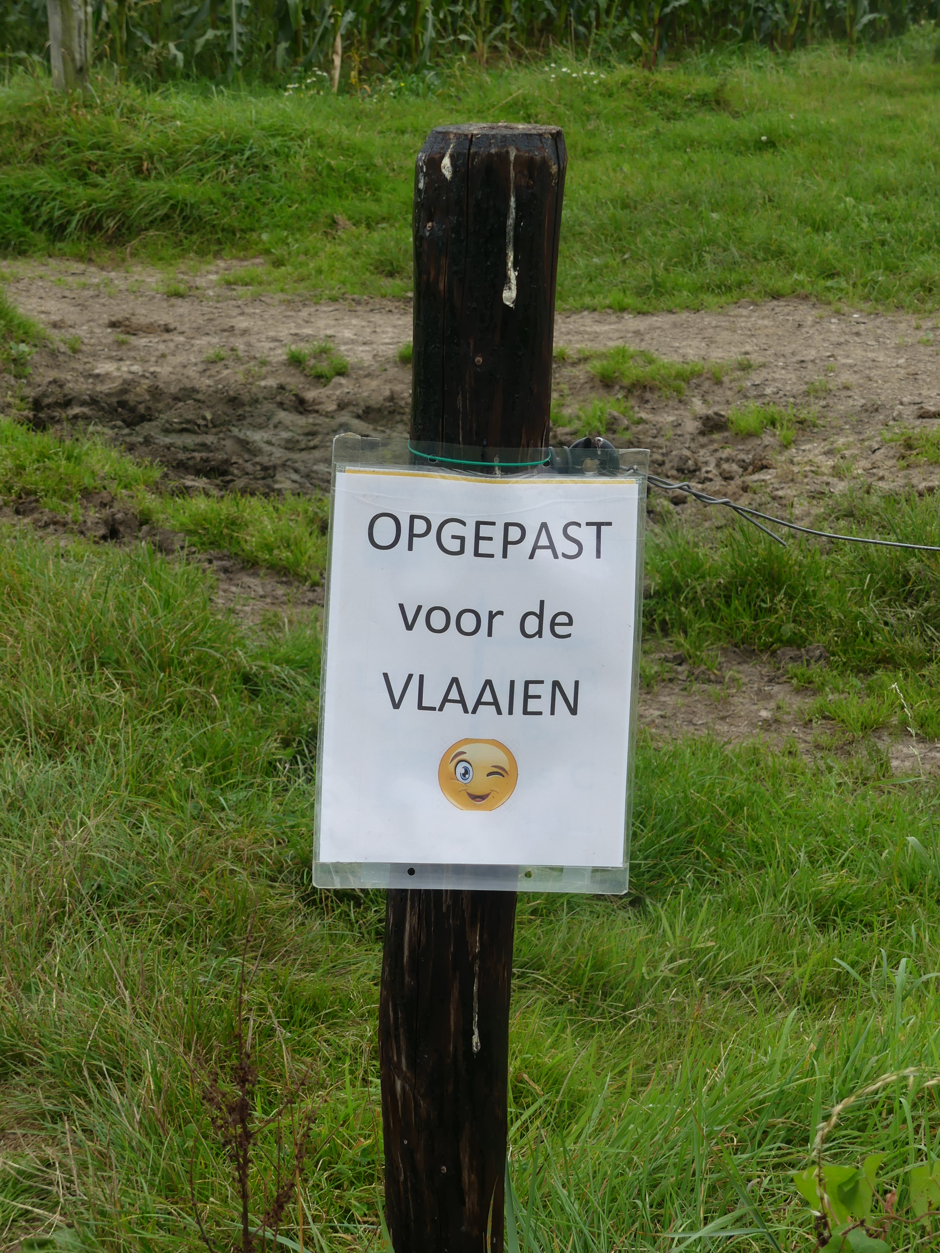 Bordje met opgepast voor vlaaien